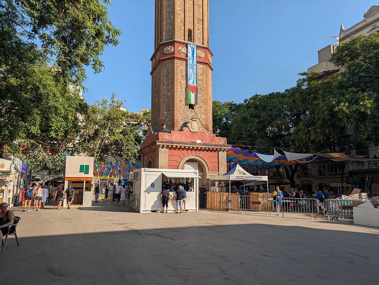 Clock tower rising over Plaça de la Vila de Gràcia, a neighbourhood square in Gràcia, Barcelona