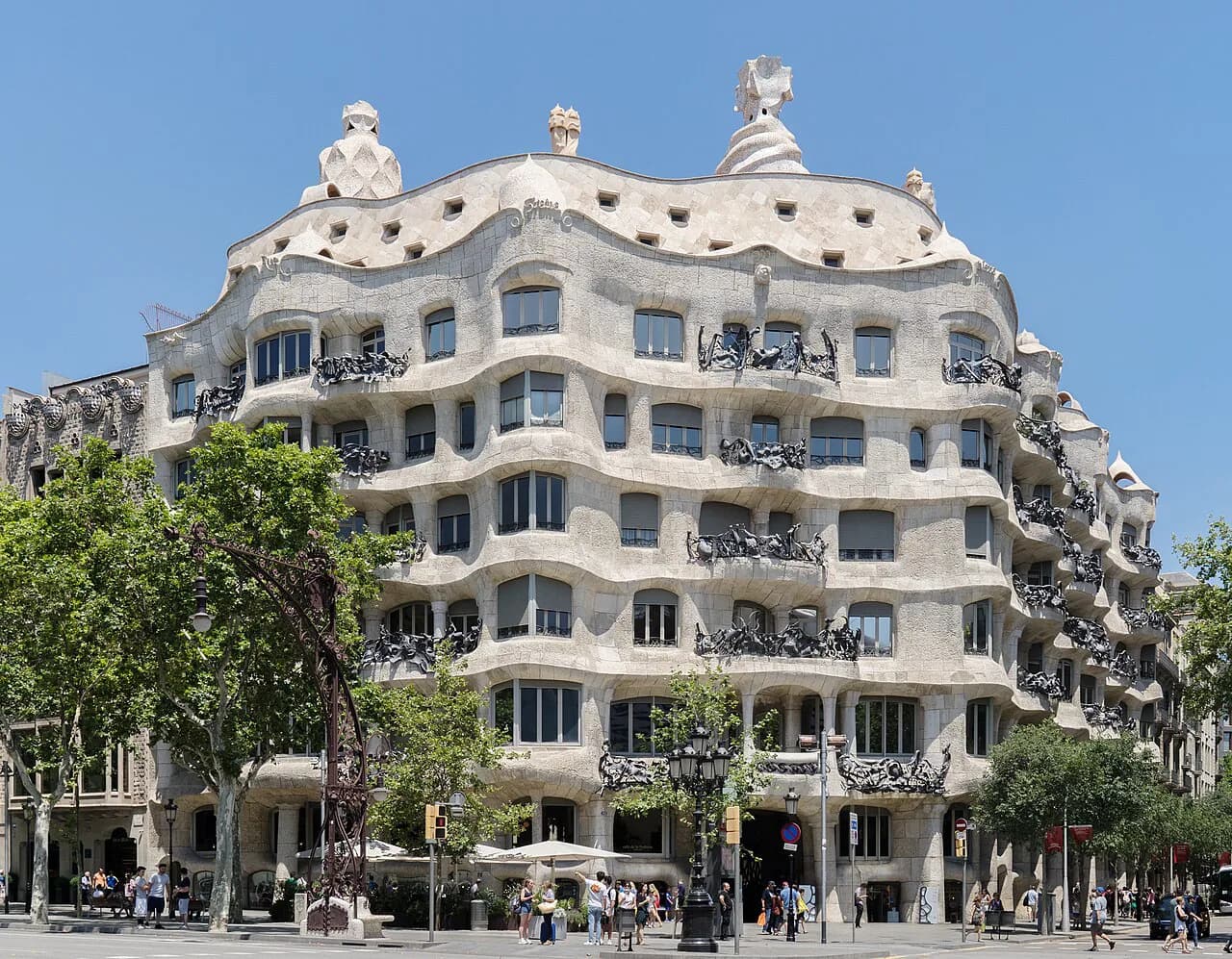 The undulating stone facade of Gaudí's Casa Milà on Passeig de Gràcia in Barcelona's Eixample