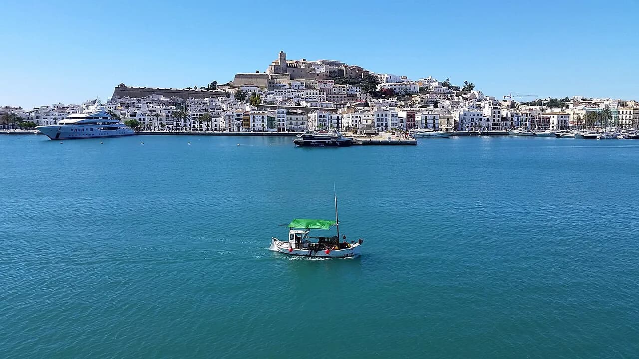 The walled hilltop old town of Dalt Vila and its cathedral above the blue water of Ibiza Town's harbour