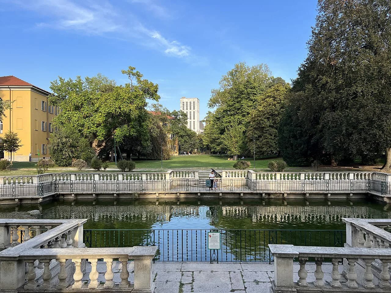 The baroque fish pond with stone balustrades in the Giardino della Guastalla, a quiet walled garden in central Milan