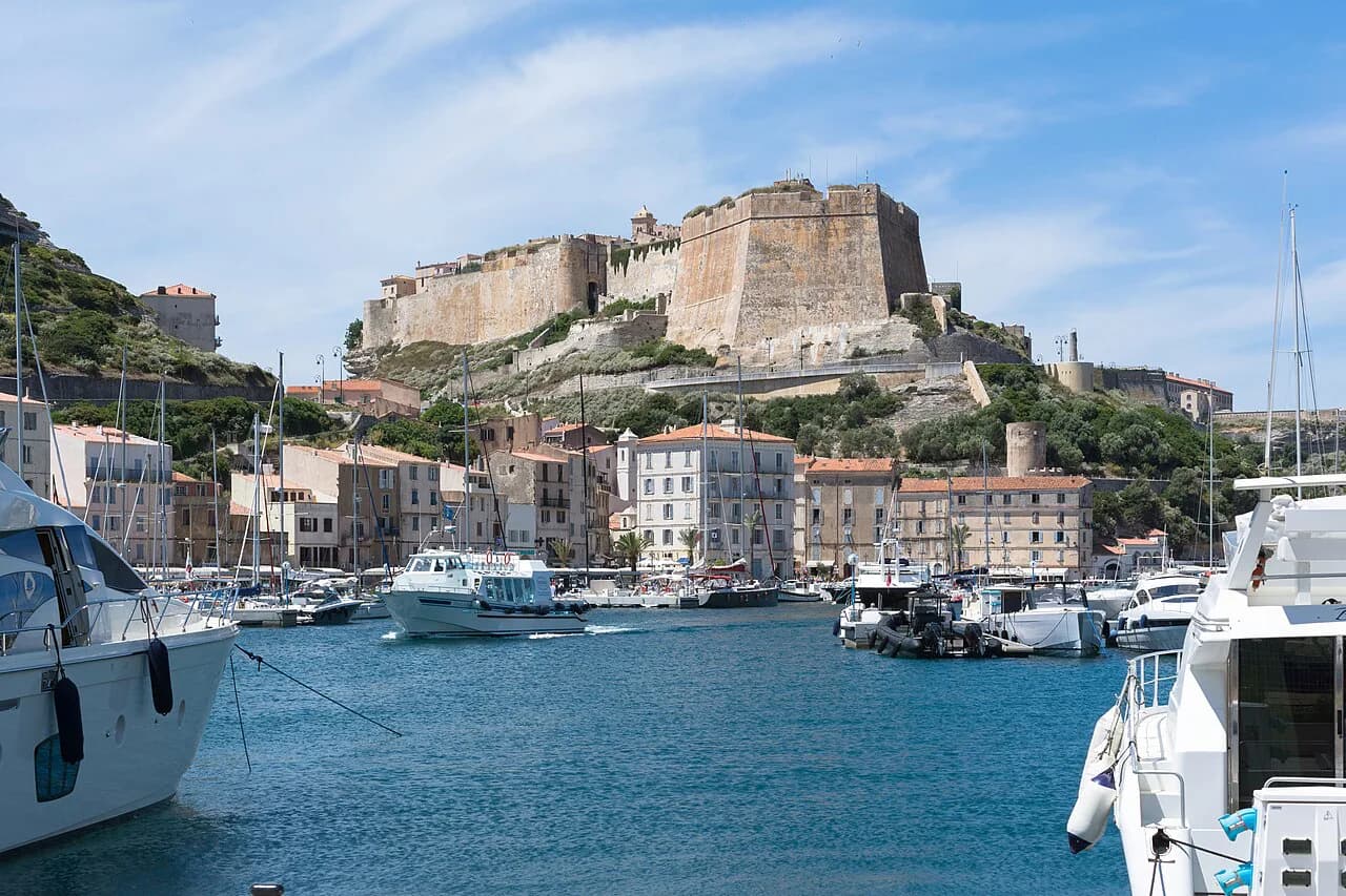 Boats in Bonifacio marina below the citadel and upper town walls, Corsica