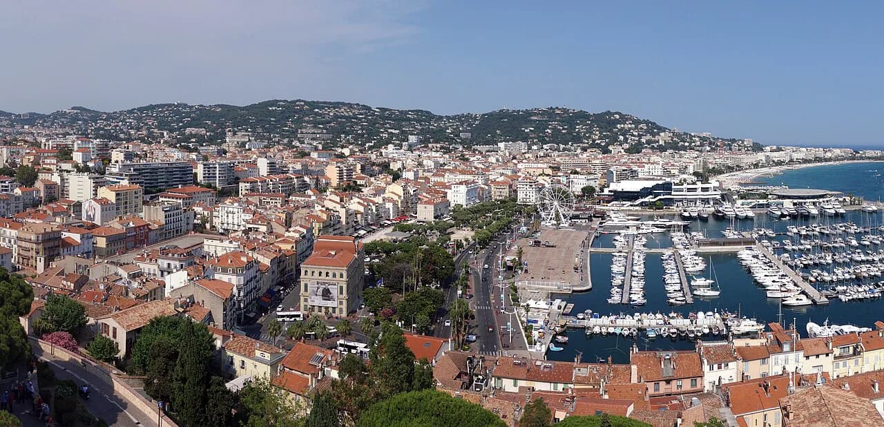 Panorama of Cannes from the Suquet Tower, with red roofs, the Old Port marinas and the bay