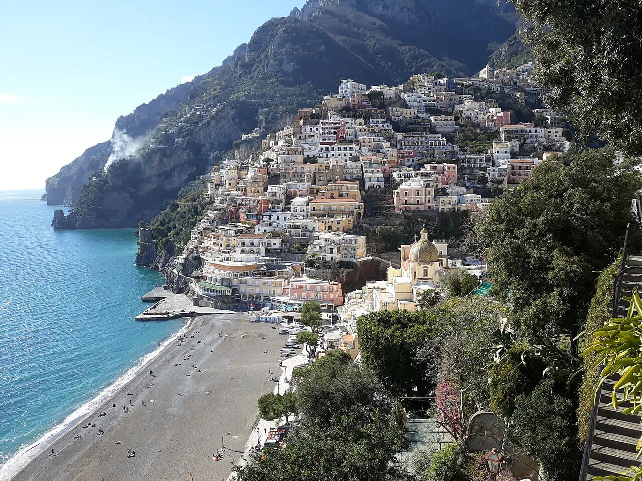 Spiaggia Grande beach below Positano's stacked hillside houses and the domed church