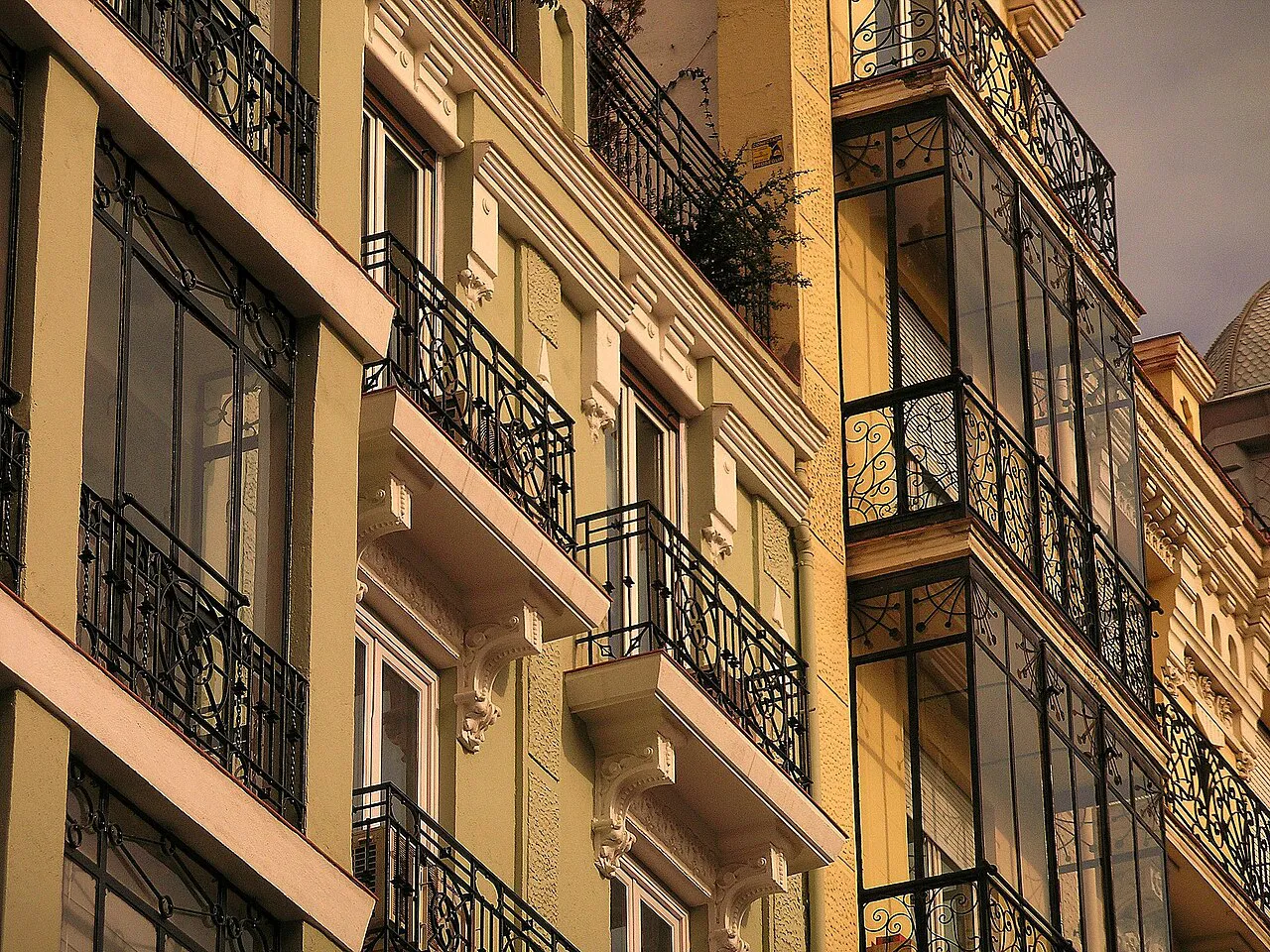 Ornate balconies and glazed galleries on early-20th-century apartment buildings in Madrid’s Salamanca district