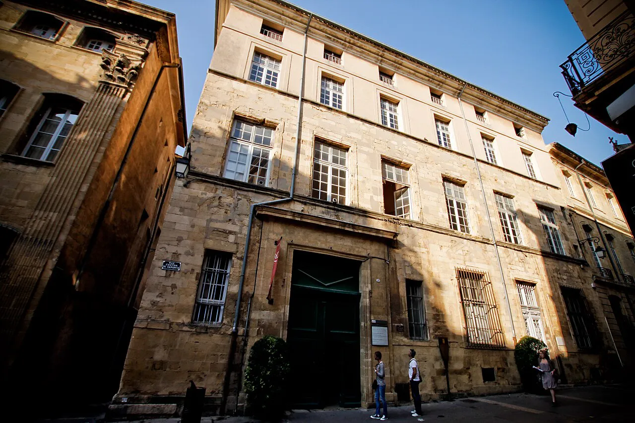 Historic stone mansion facade on Rue Gaston de Saporta in old Aix-en-Provence