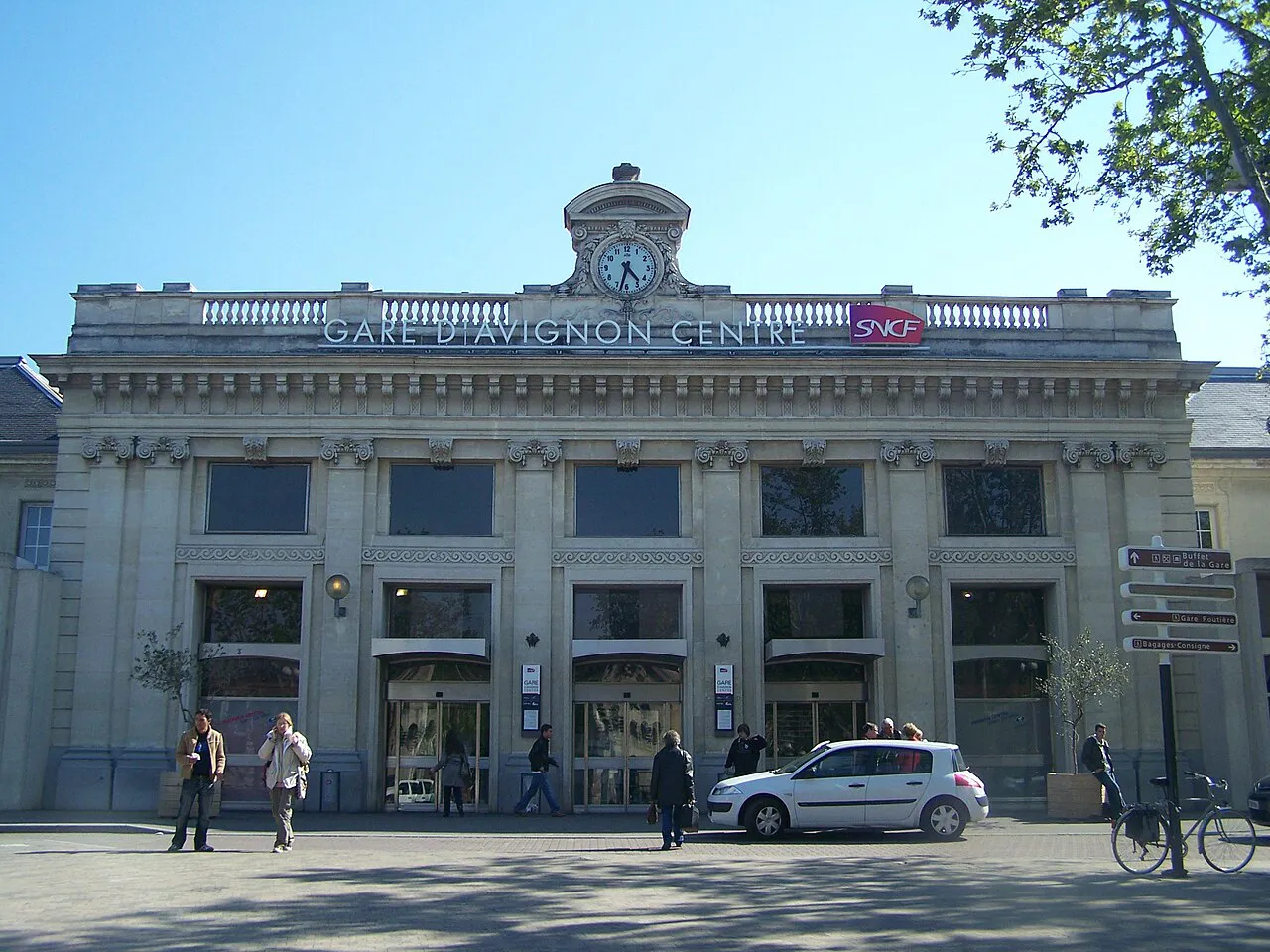 Neoclassical front of Avignon-Centre railway station with its clock and arched windows