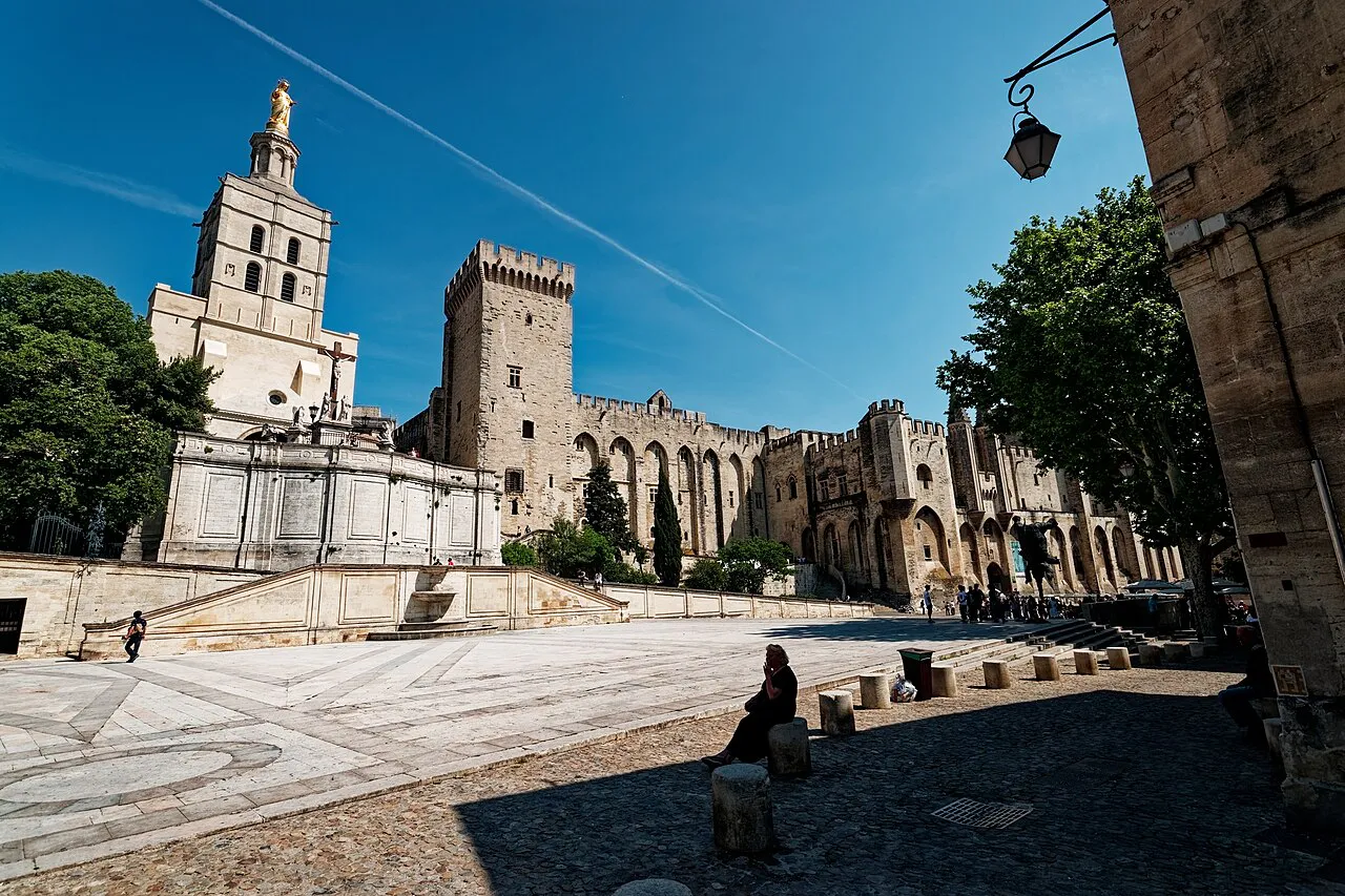 Place du Palais in Avignon with the bell tower of Notre-Dame des Doms and the towers of the Palais des Papes