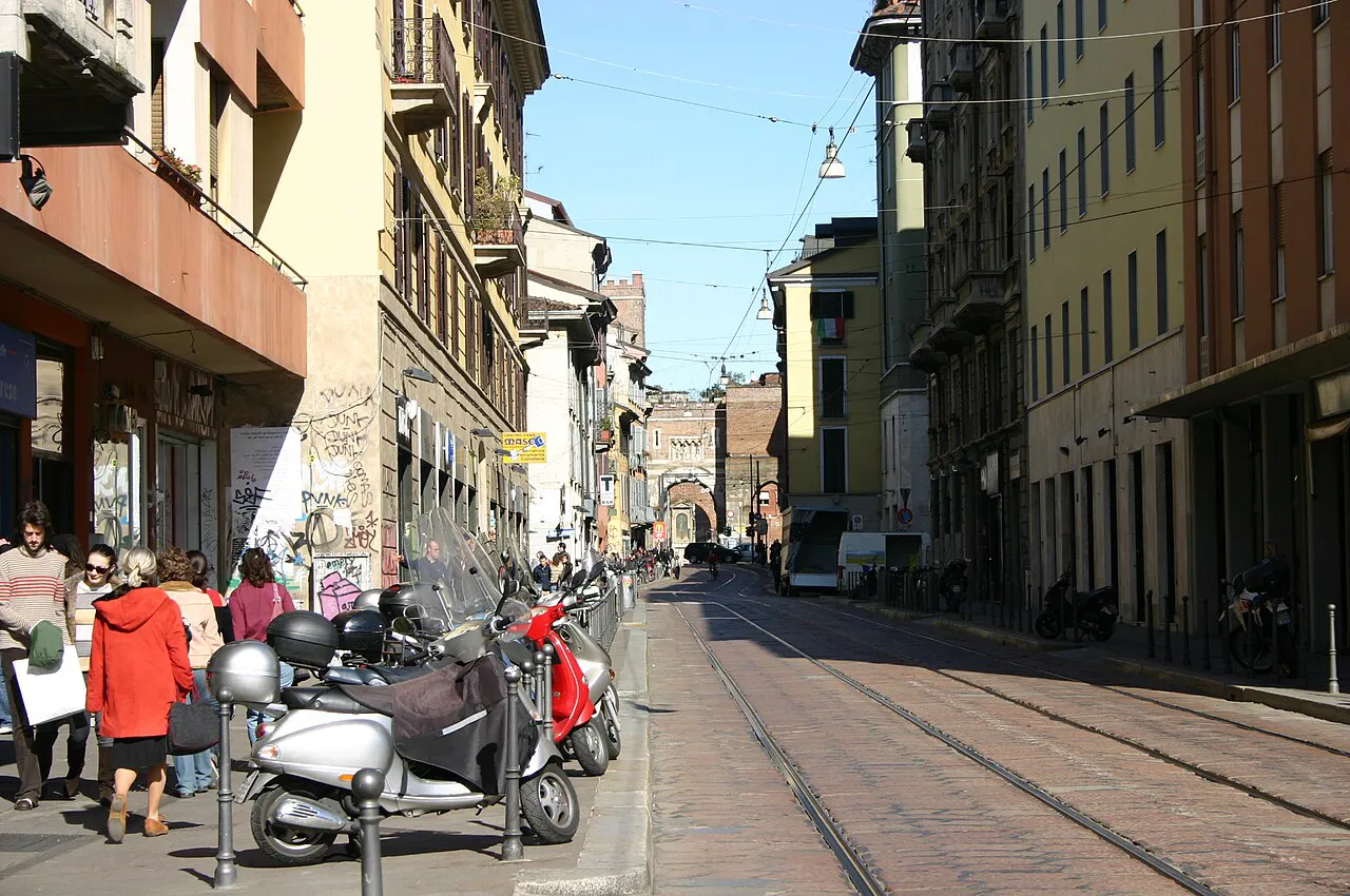Corso di Porta Ticinese in Milan with tram tracks leading toward the medieval Porta Ticinese gate