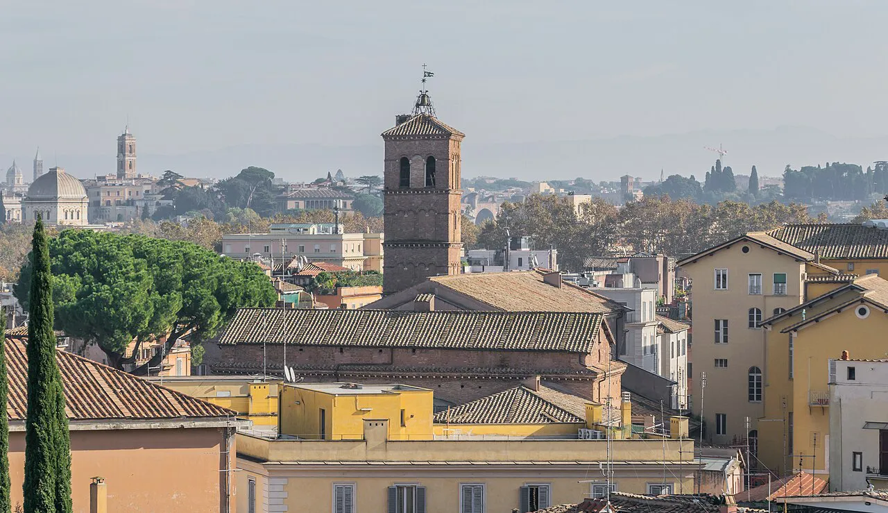 Bell tower of Santa Maria in Trastevere rising above the rooftops of Trastevere, Rome