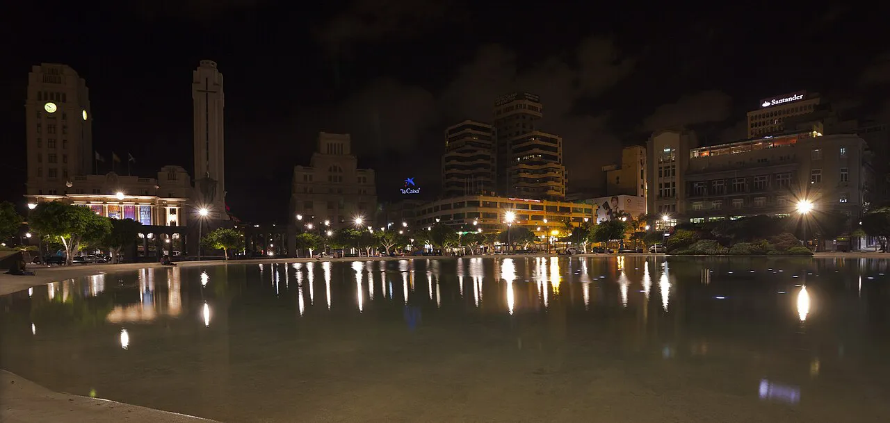 Plaza de España in Santa Cruz de Tenerife at night, city lights reflected in its large pool