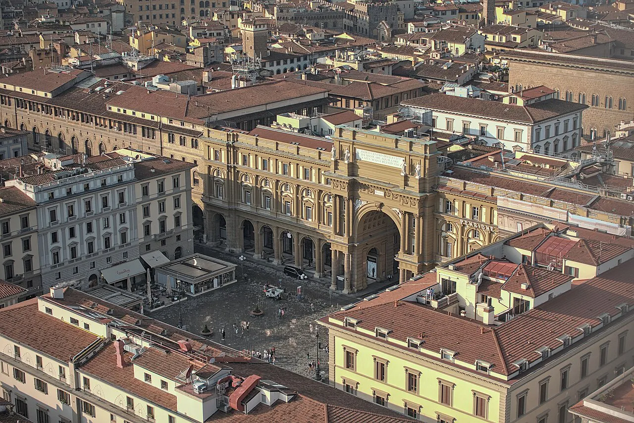 Aerial view of Piazza della Repubblica and its triumphal arch amid Florence rooftops, from Giotto's Bell Tower