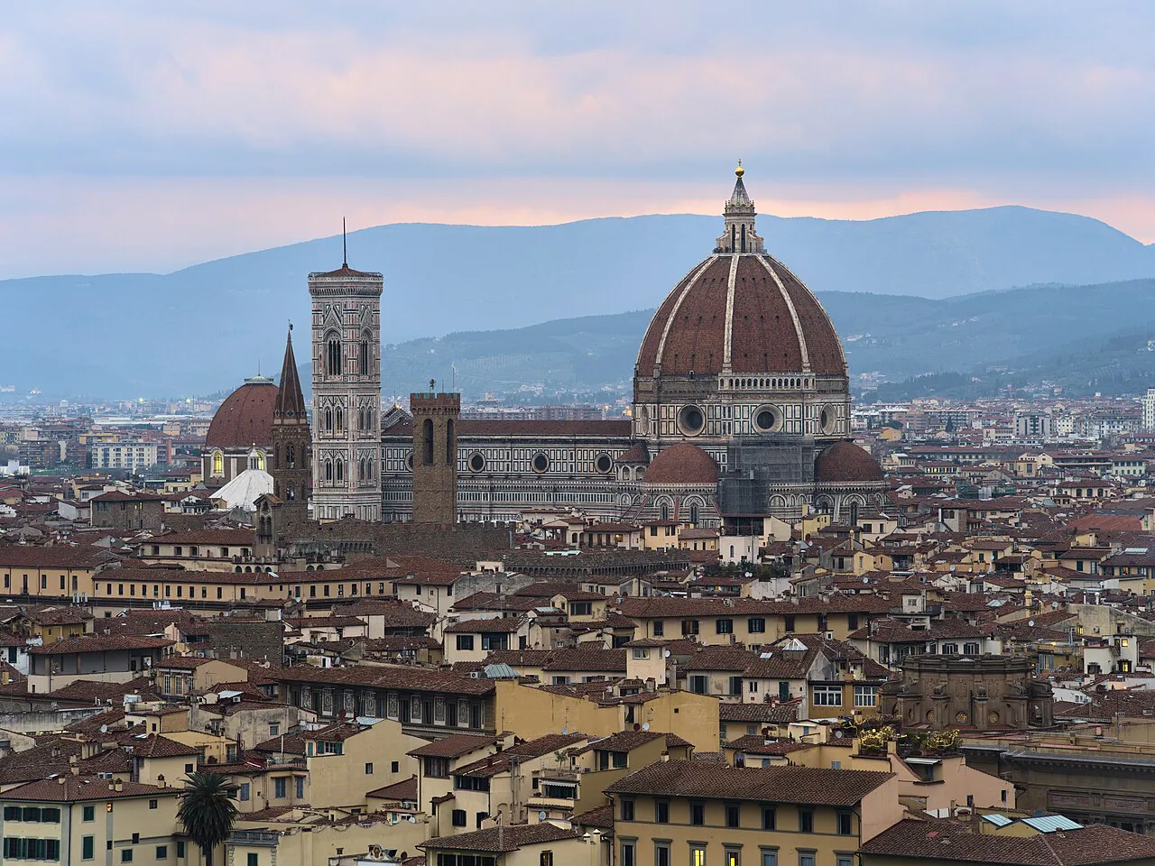 Florence Cathedral dome and Giotto's Bell Tower above the city rooftops, seen from Piazzale Michelangelo
