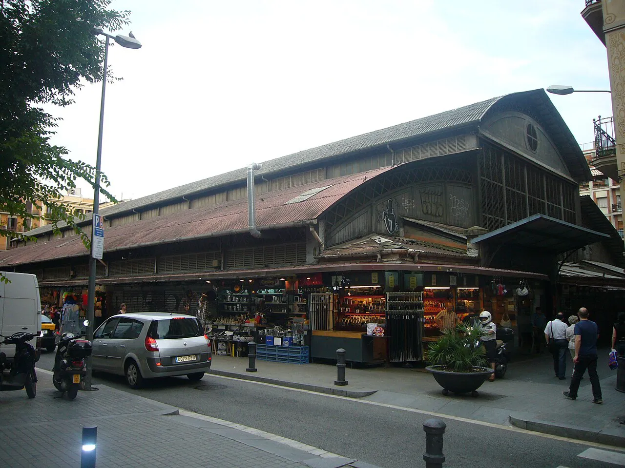 Iron-and-timber hall of the Mercat de l'Abaceria Central market on a Gràcia street in Barcelona