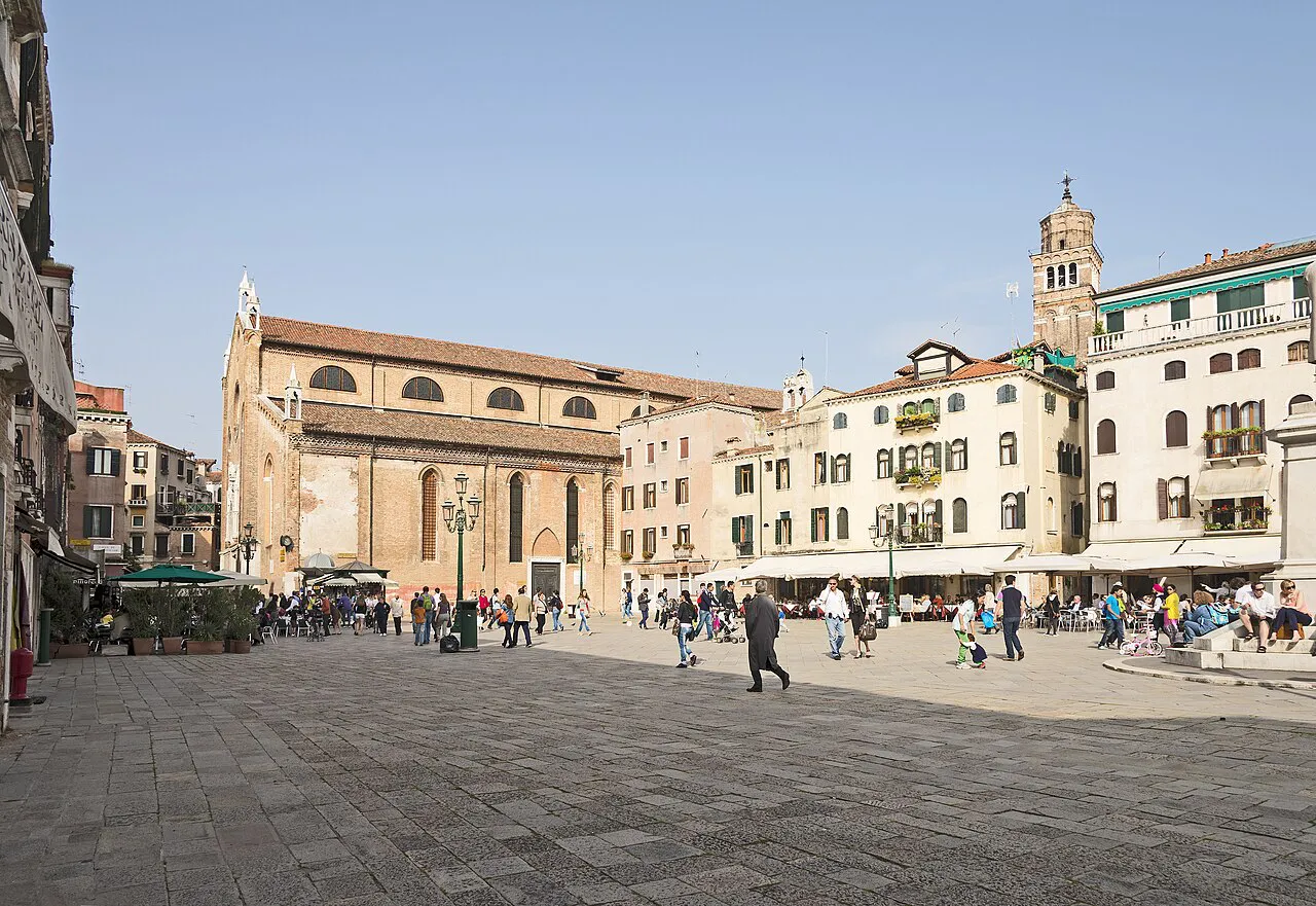 Wide paved Campo Santo Stefano in the San Marco district of Venice, with the church and bell tower