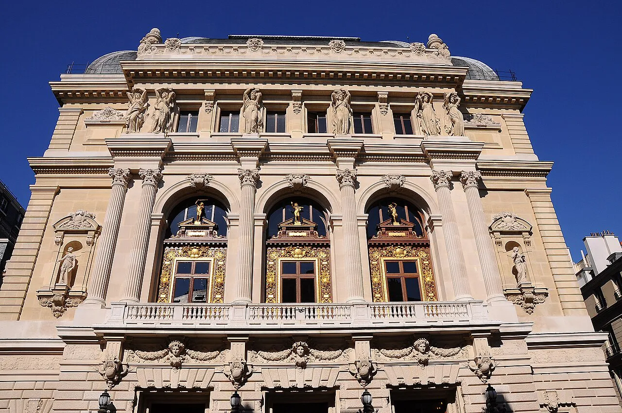 Ornate facade of the Opéra-Comique (Salle Favart) on Place Boieldieu, Paris