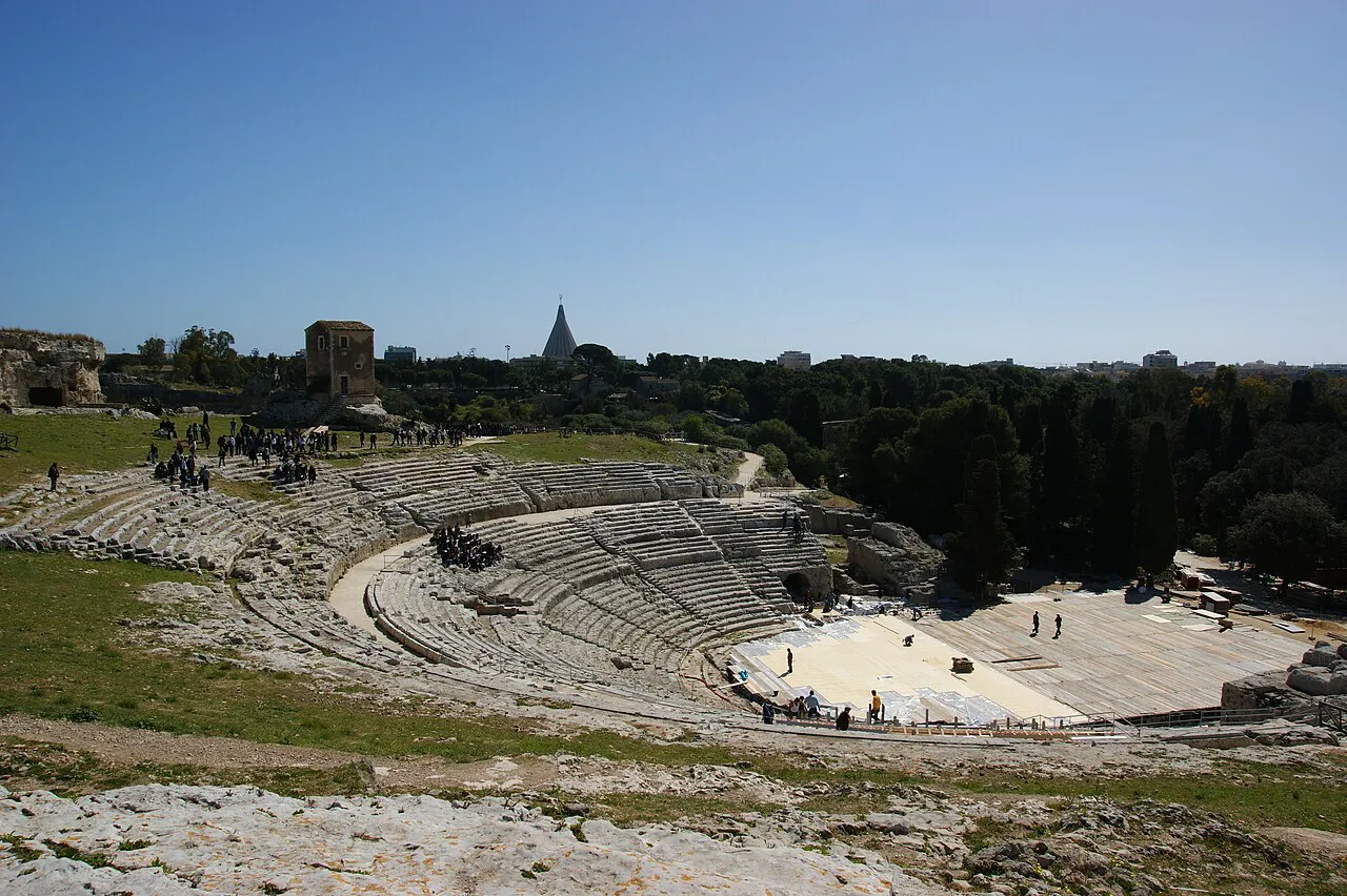 The semicircular stone seating of the Greek Theatre in the Neapolis archaeological park, Siracusa
