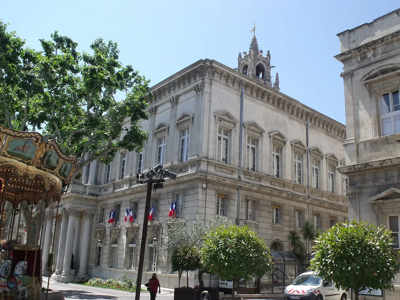 Neoclassical Hôtel de Ville on Place de l’Horloge in Avignon, framed by plane trees