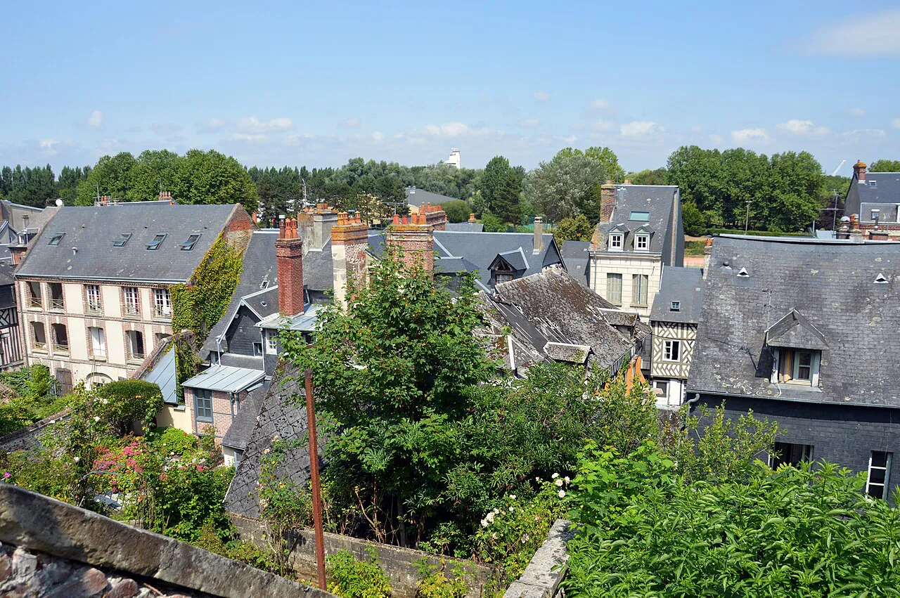 Slate rooftops and gardens of Honfleur's old town seen from Rue de l'Homme de Bois