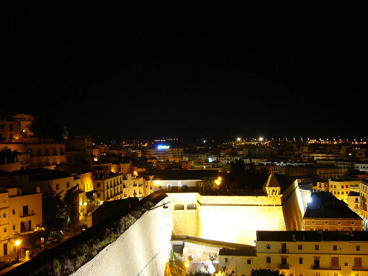Floodlit Renaissance walls of Dalt Vila and the lights of Ibiza Town at night
