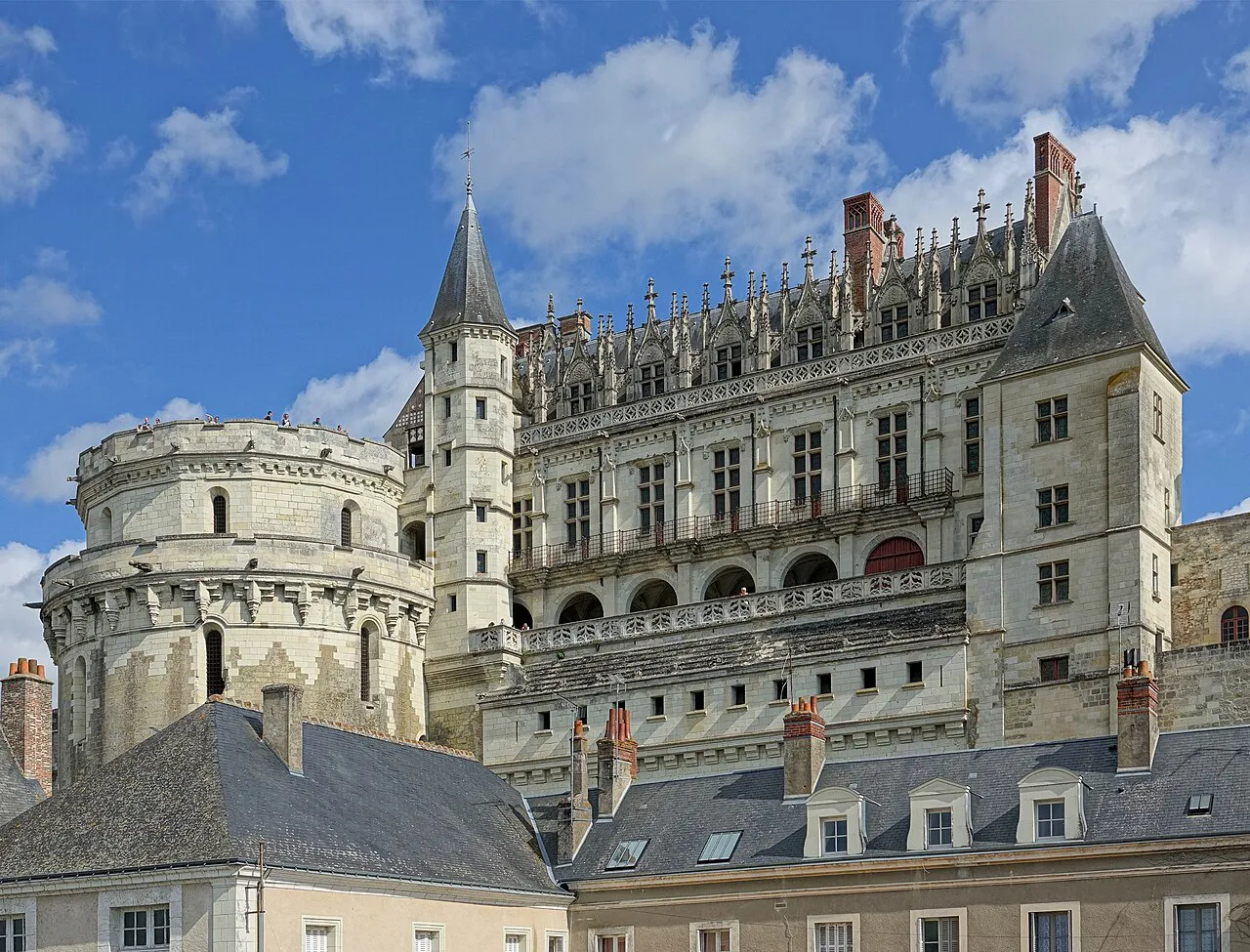 The ornate Renaissance wing and round Tour des Minimes of the Château d'Amboise under a blue sky