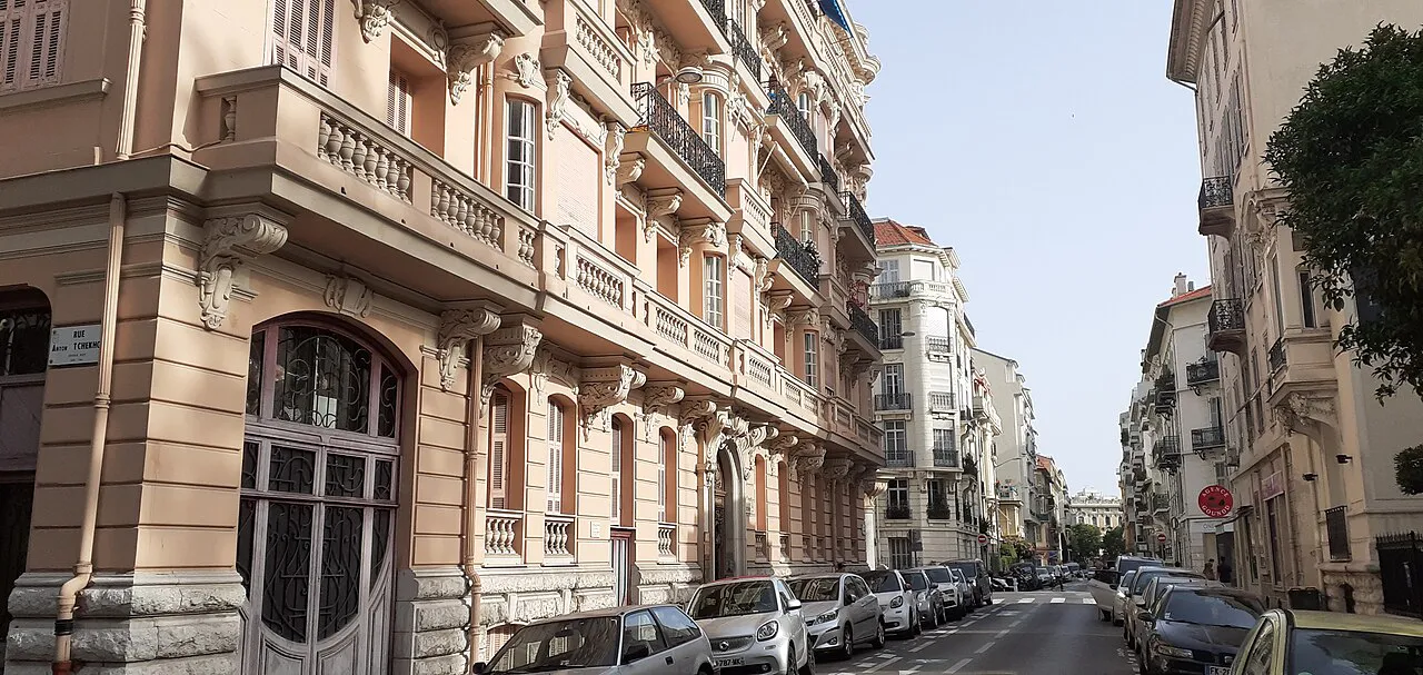 Tree-lined residential street of Belle Époque apartment buildings in the Musiciens quarter of Nice