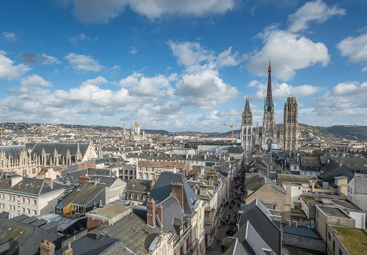 View over Rouen’s rooftops toward the cathedral spire, seen from the Gros-Horloge belfry