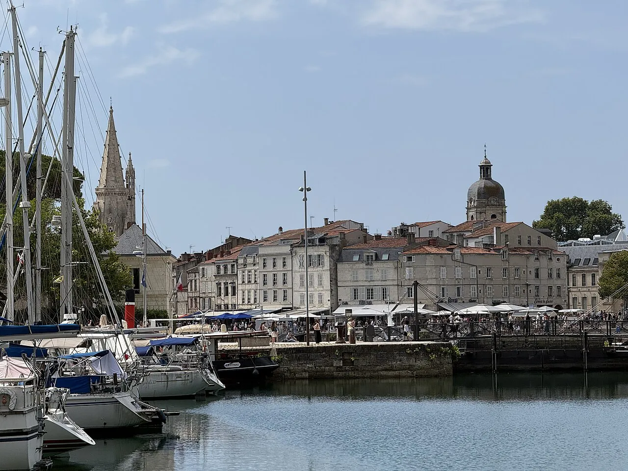 Moored sailing boats in La Rochelle’s Vieux-Port, with the Saint-Sauveur spire over the quayside