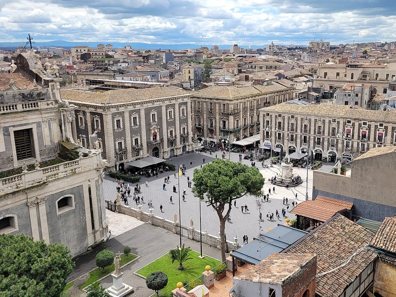 Elevated view over Piazza del Duomo and the baroque rooftops of Catania toward the sea