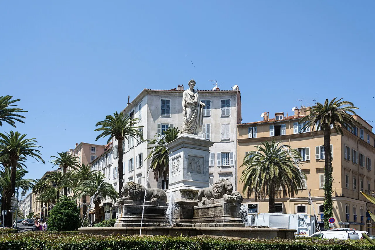 Napoleon statue and the Fountain of the Four Lions among palm trees on Place Foch, Ajaccio