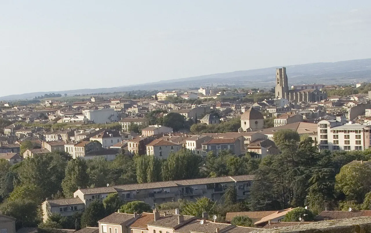 View from the Porte d'Aude over the roofs of Carcassonne's lower town towards the Saint-Vincent bell tower