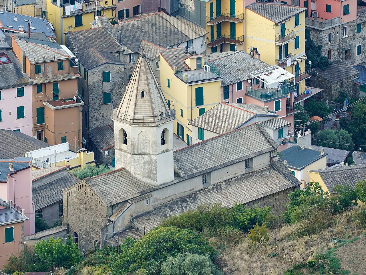 Rooftops and the bell tower of San Pietro church clustered on the hillside of Corniglia