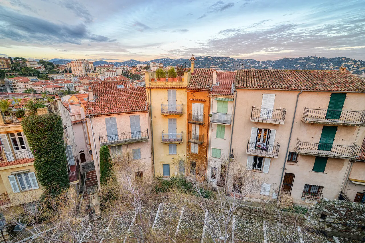 Pastel houses with shuttered balconies on the slopes of Le Suquet, the old quarter of Cannes