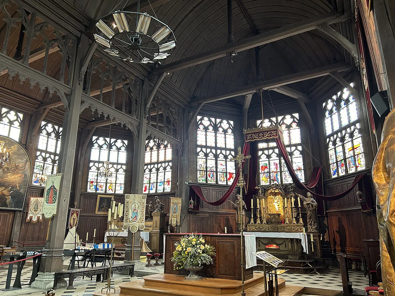 Wooden vaulted interior and stained-glass windows of Sainte-Catherine church in Honfleur