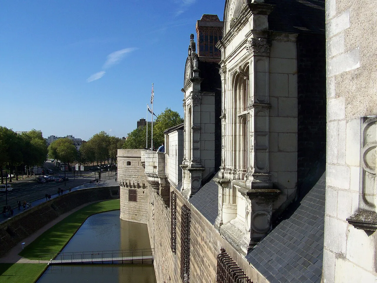 Stone ramparts and moat of the Château des ducs de Bretagne in central Nantes on a sunny day