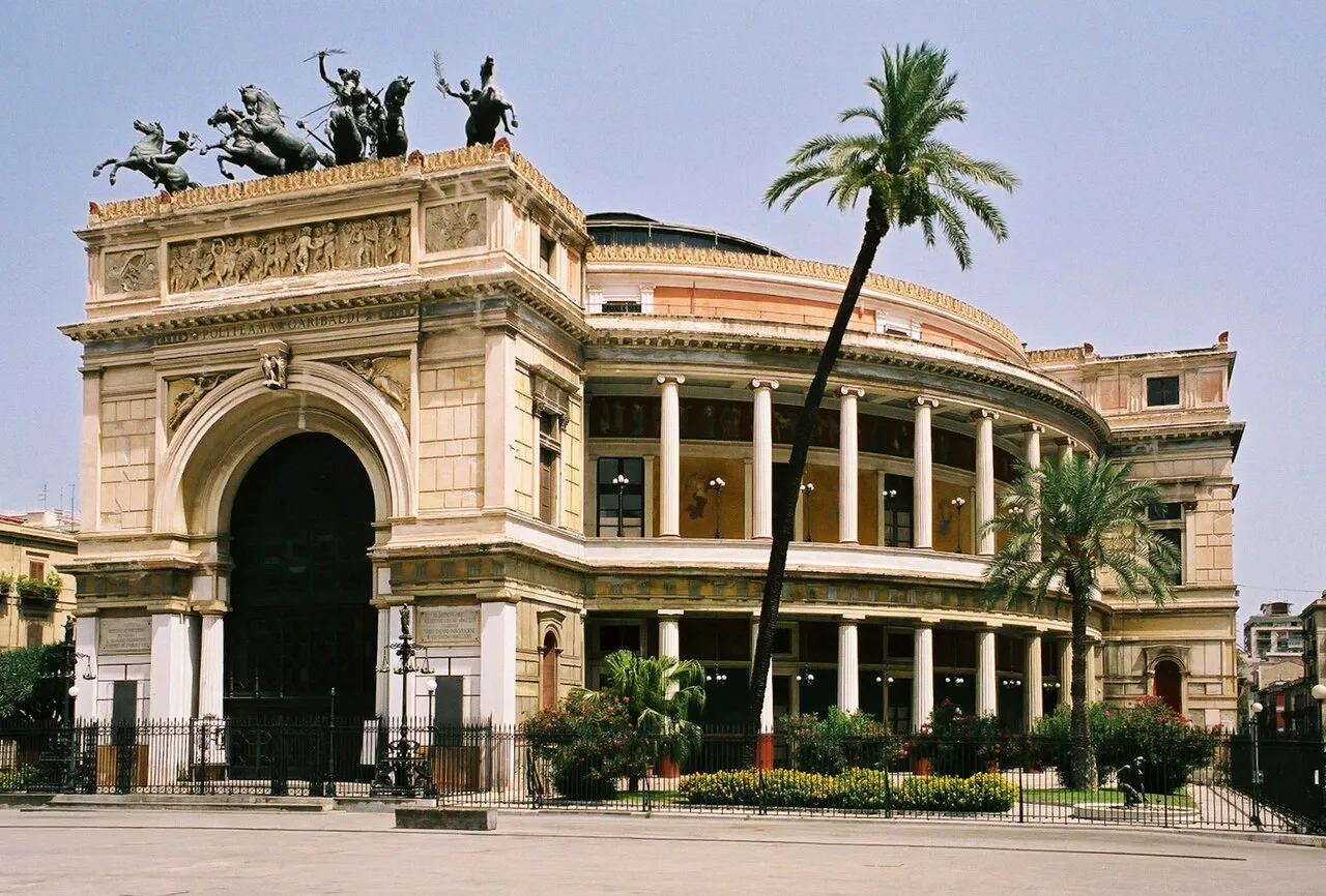 Teatro Politeama Garibaldi with its bronze quadriga and palm trees, Palermo