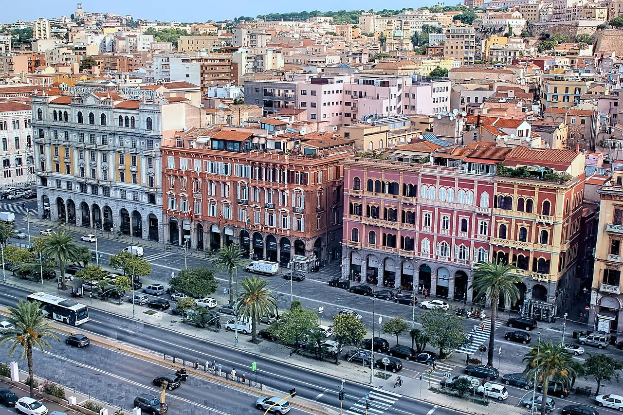 Elevated view of the arcaded pastel facades along Via Roma at the edge of Cagliari's Marina district