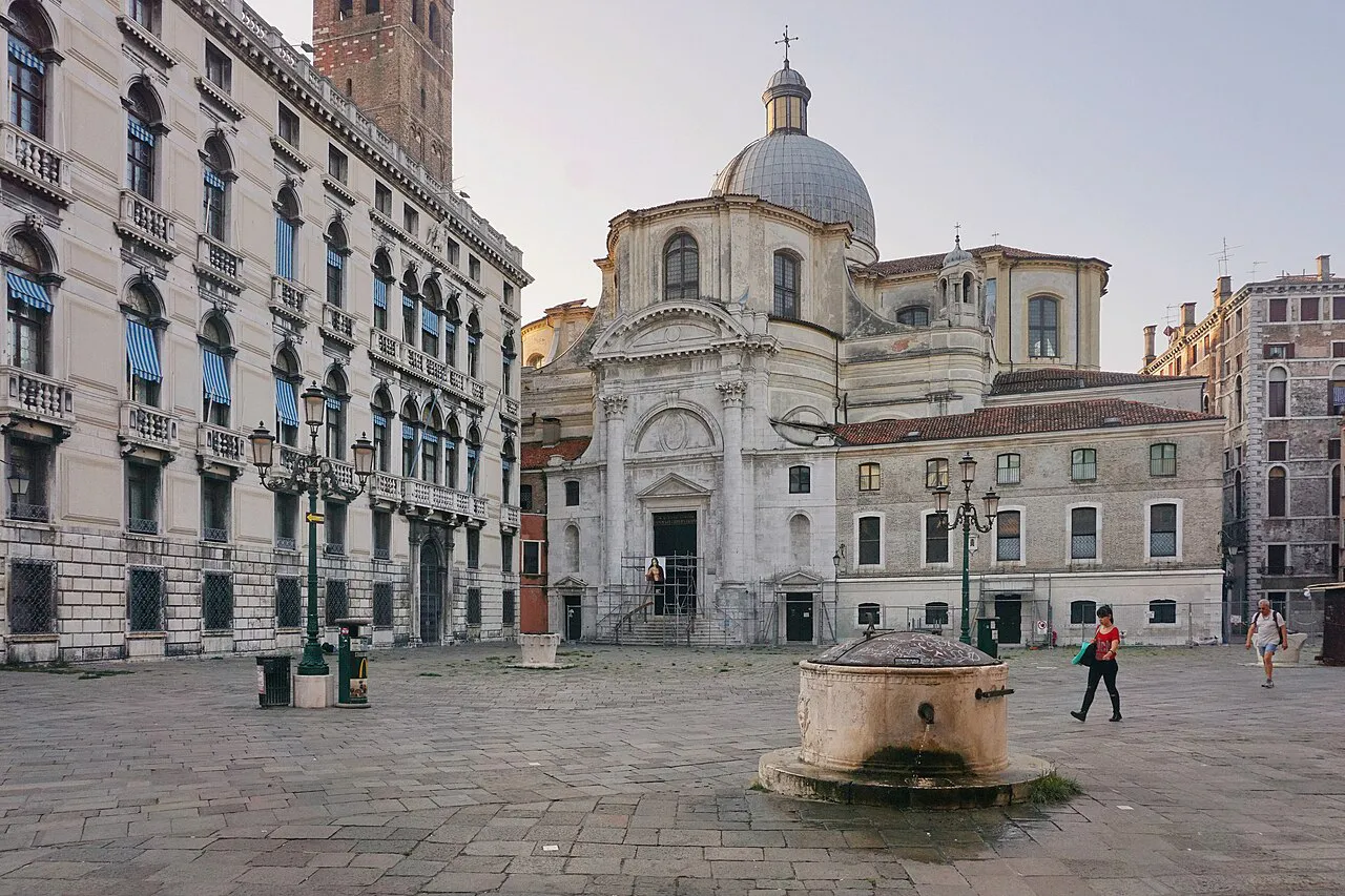 Campo San Geremia in Venice with the domed San Geremia church and a stone wellhead