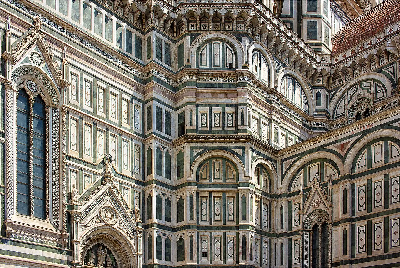 Close view of the green, white and pink marble side walls of Florence Cathedral