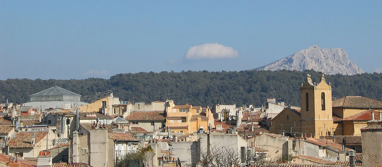 Montagne Sainte-Victoire seen beyond the rooftops and church tower of Aix-en-Provence
