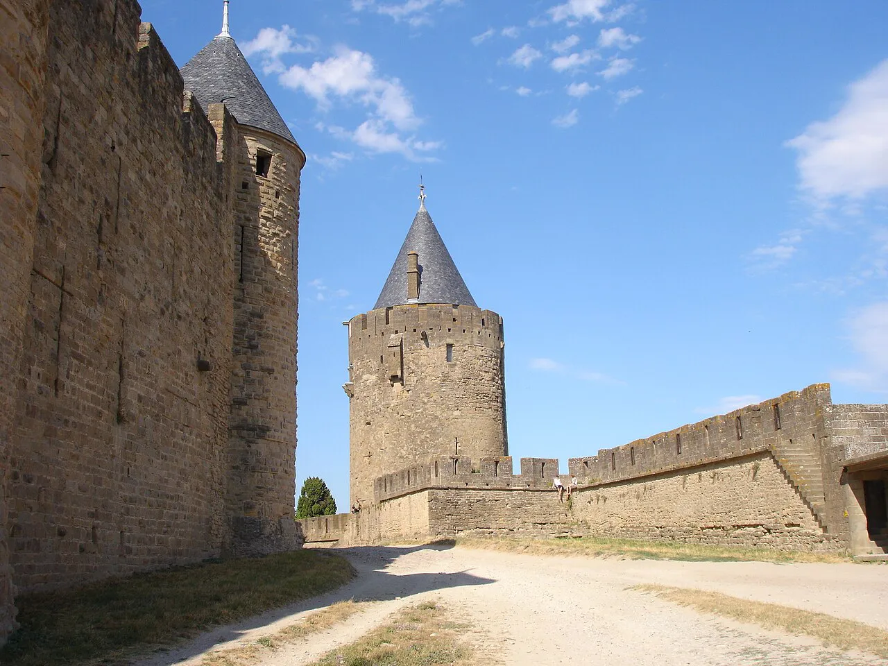 The upper Lices of the Cité de Carcassonne, an open path between the walls with a pointed-roof tower