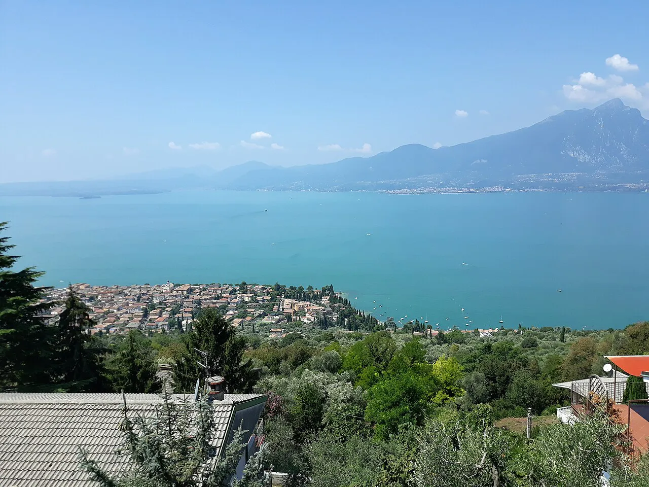 Torri del Benaco and the turquoise water of Lake Garda seen from the hillside at Albisano
