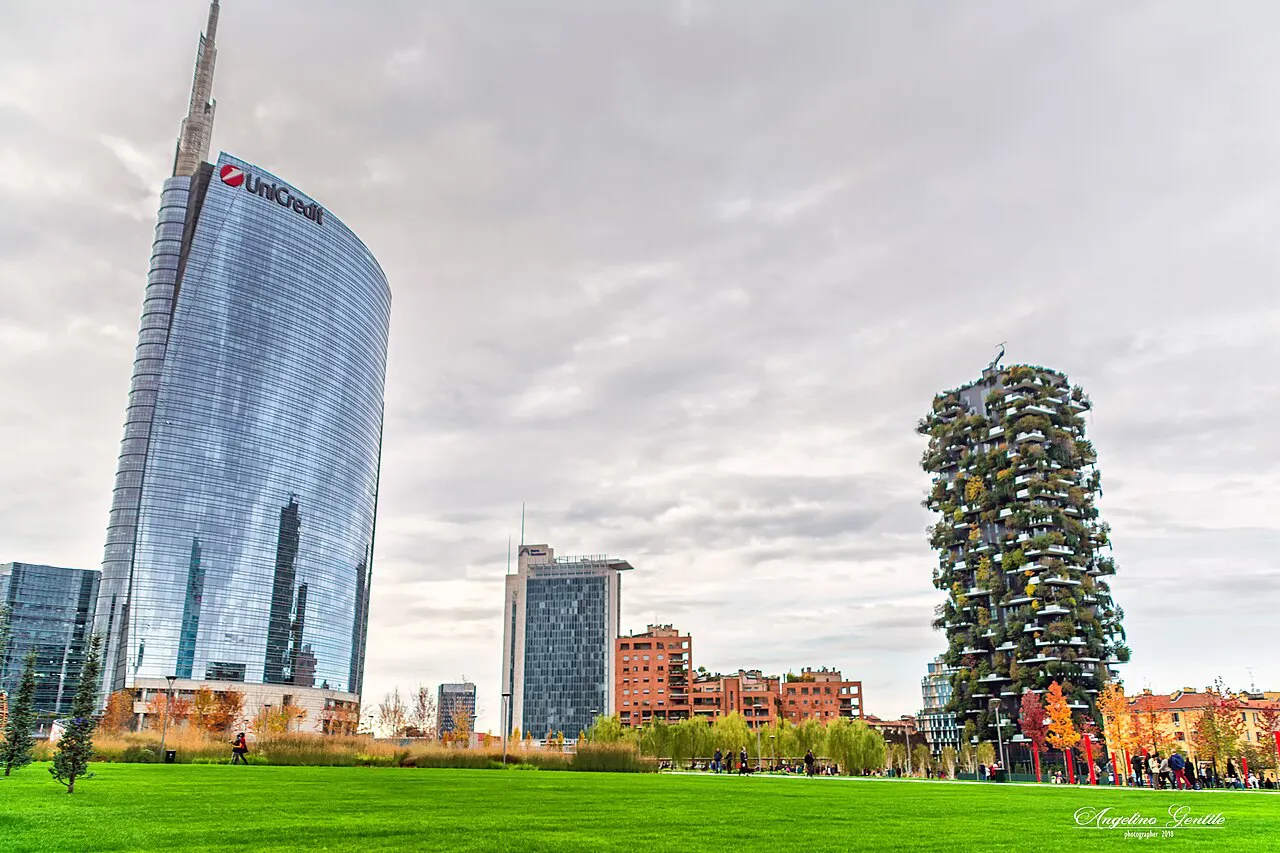 UniCredit Tower and the Bosco Verticale towers rising beyond a lawn in Milan’s Porta Nuova district