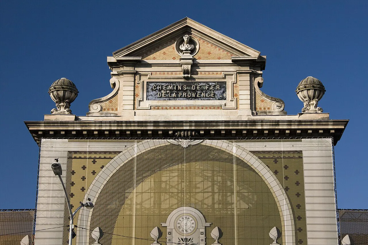 Carved stone pediment of the Gare du Sud facade in Nice, inscribed Chemins de fer de Provence