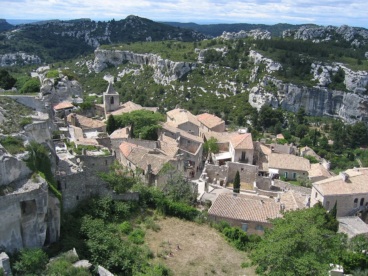 Rooftops of Les Baux-de-Provence village below the limestone hills of the Alpilles