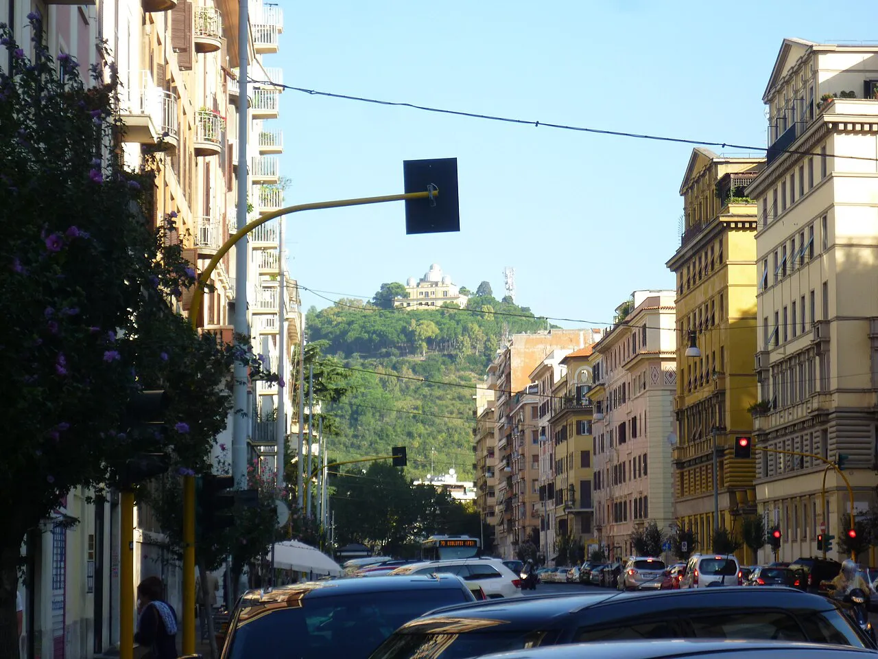 Via della Giuliana in Rome with the wooded Monte Mario and its observatory at the end of the street