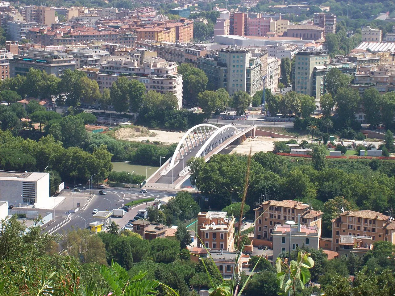 Flaminio quarter of Rome seen from Monte Mario, with a white arched footbridge over the Tiber