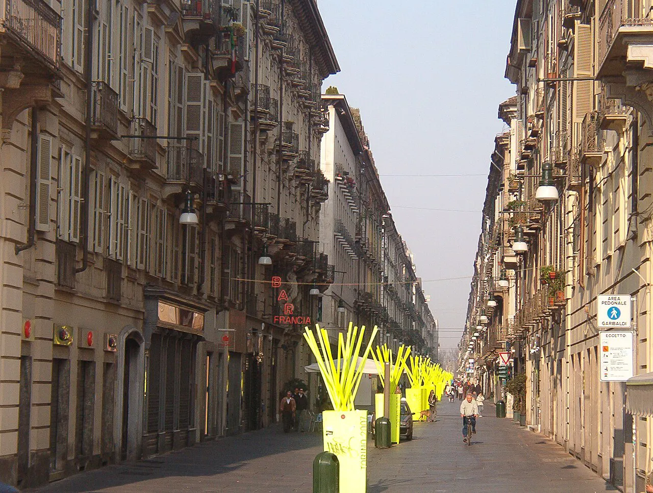 Long, quiet pedestrian Via Garibaldi in central Turin lined with tall historic facades