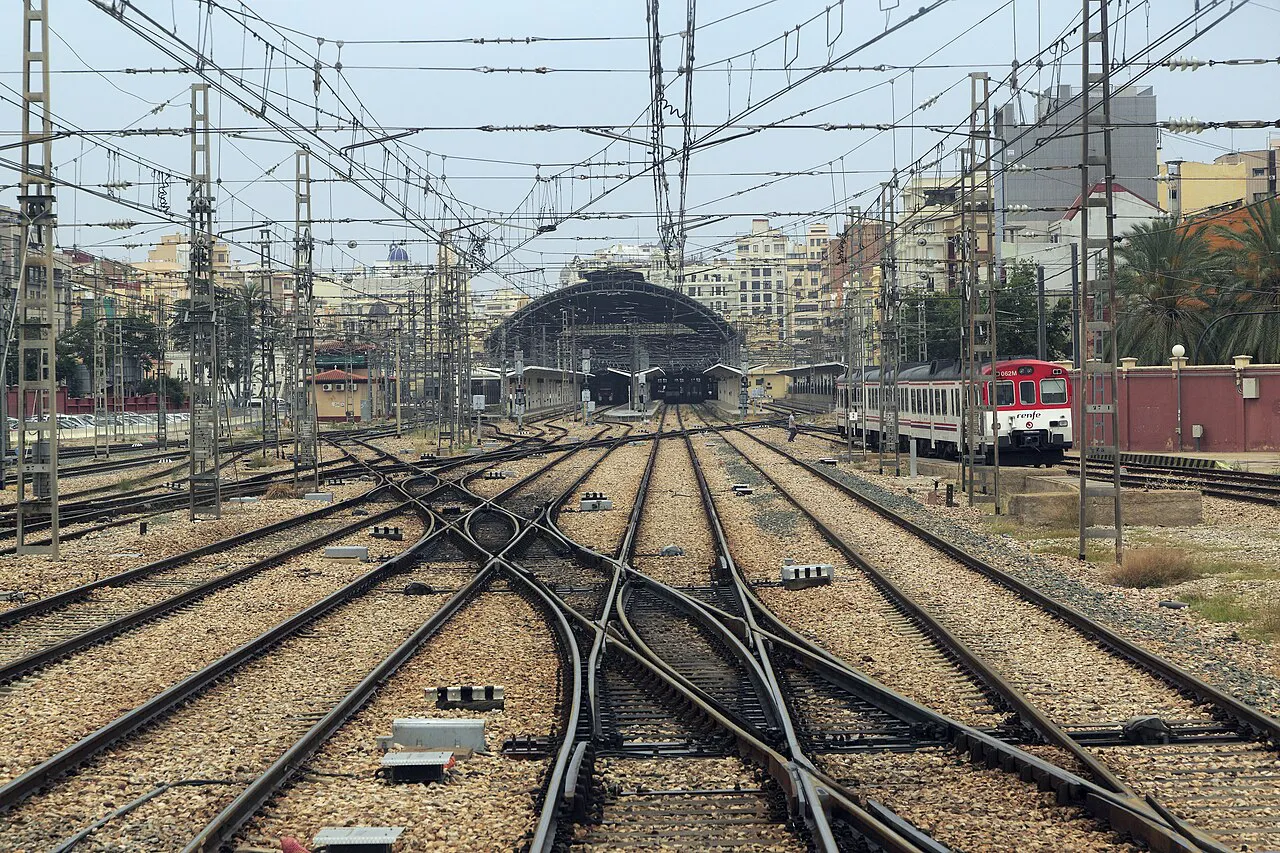 Railway tracks and points converging on the train shed of València Nord station