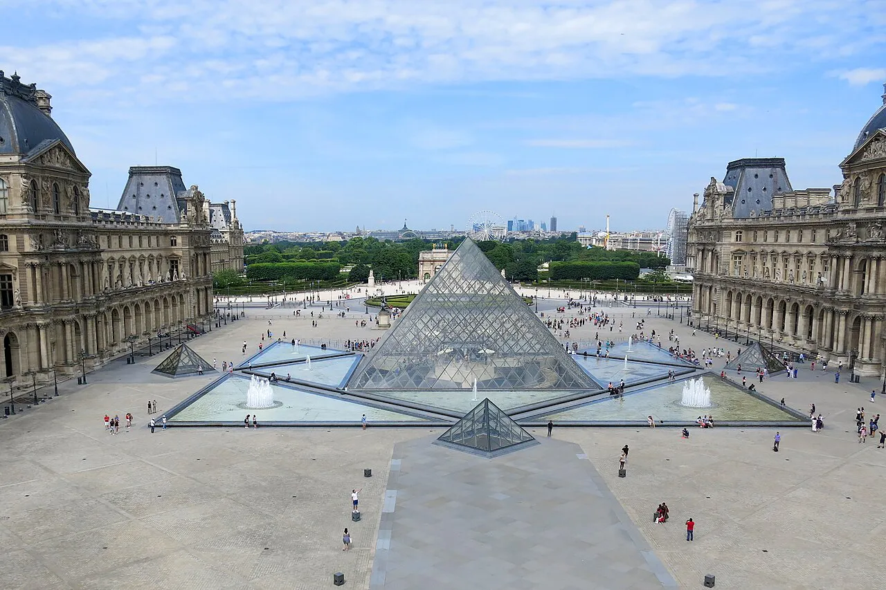 The Louvre Pyramid and Cour Napoléon seen from above, framed by the wings of the Louvre Palace, Paris