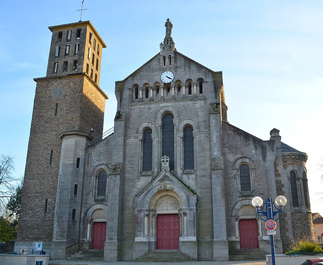 Stone façade and bell tower of the Église Notre-Dame-des-Apôtres in Les Couëts, Bouguenais, near Nantes